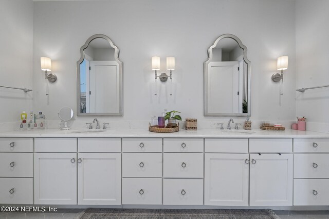 bathroom featuring tile patterned floors and vanity