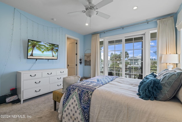 bedroom featuring access to exterior, ceiling fan, and light carpet