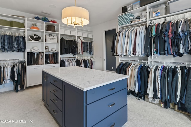 spacious closet with light colored carpet