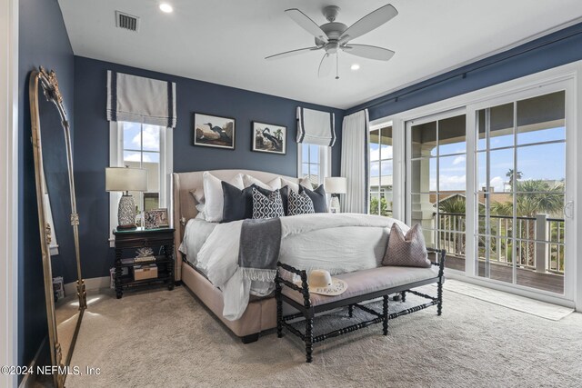 carpeted bedroom featuring ceiling fan and access to outside