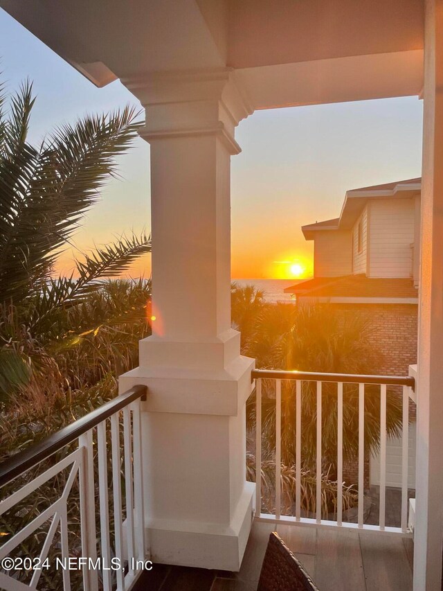 view of balcony at dusk