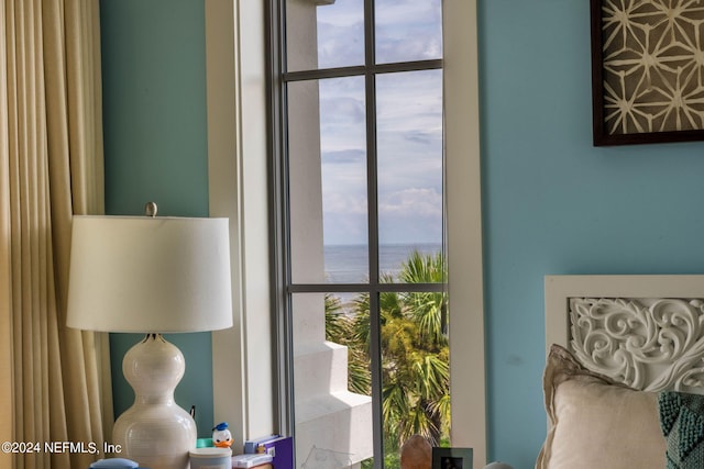 sitting room with a water view and plenty of natural light