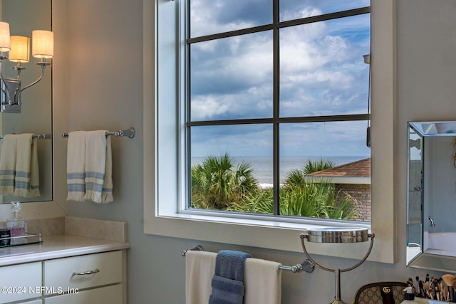 bathroom with vanity and a water view