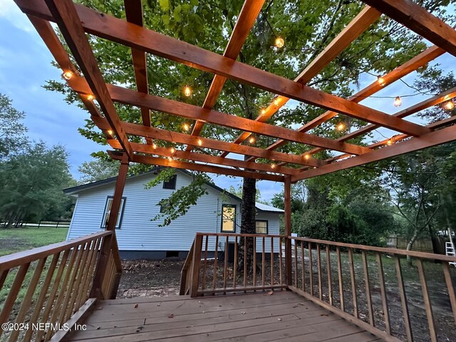 wooden deck featuring a pergola