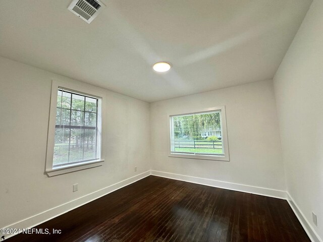 spare room featuring hardwood / wood-style flooring