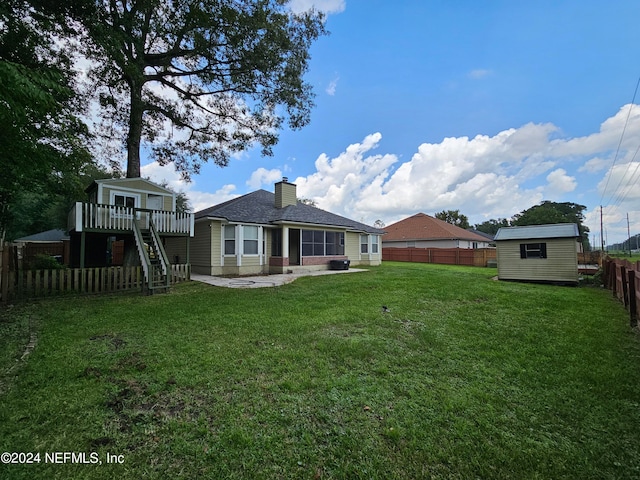 view of yard with a patio and a shed