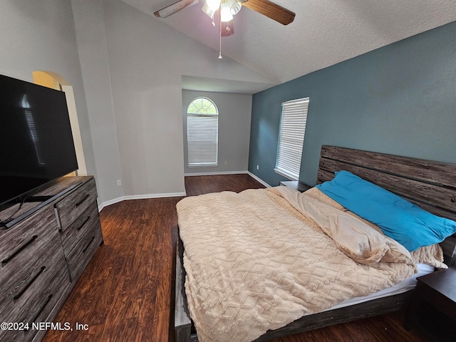 bedroom featuring ceiling fan, vaulted ceiling, a textured ceiling, and dark hardwood / wood-style floors