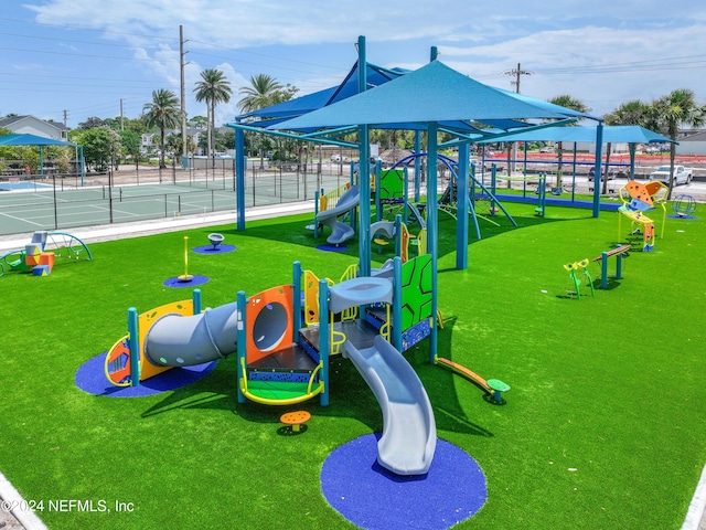 communal playground featuring fence