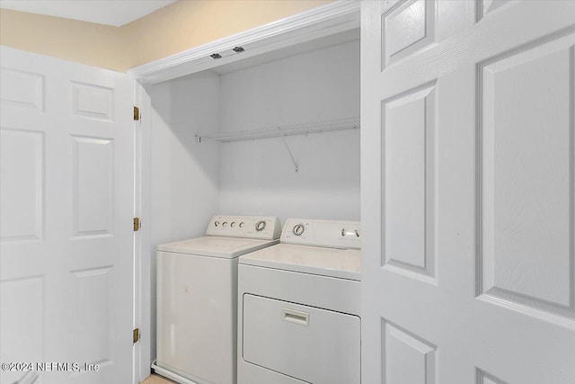 laundry area featuring laundry area and washer and clothes dryer