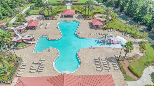 view of swimming pool with a patio