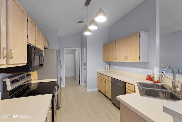 kitchen with light brown cabinets, stainless steel appliances, a sink, hanging light fixtures, and light countertops