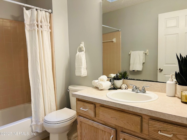 bathroom with toilet, shower / bath combo with shower curtain, a textured ceiling, and vanity