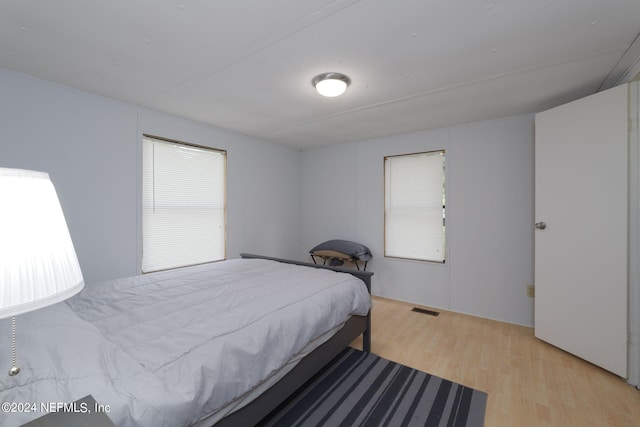 bedroom with light hardwood / wood-style floors