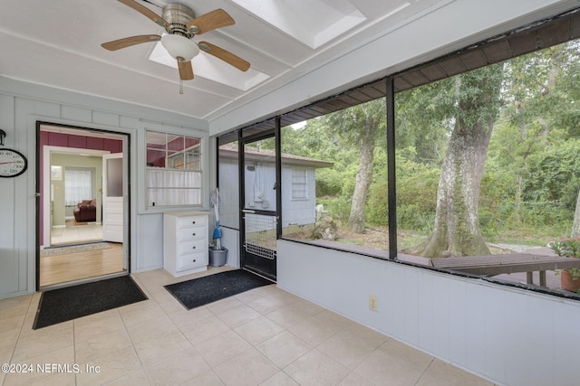 unfurnished sunroom with plenty of natural light and ceiling fan