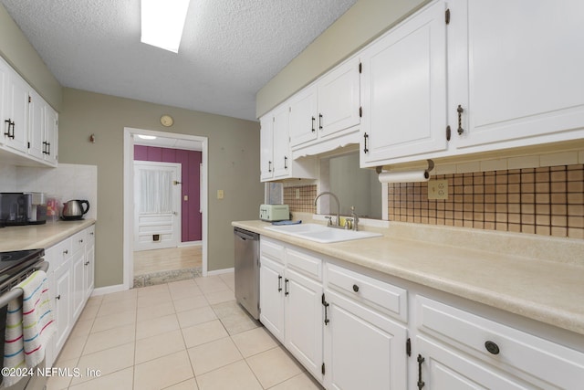 kitchen featuring backsplash, stainless steel appliances, white cabinetry, and sink