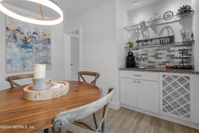 dining space with indoor wet bar