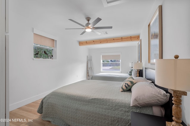 bedroom with ceiling fan and light hardwood / wood-style flooring