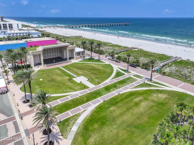 bird's eye view with a water view and a beach view