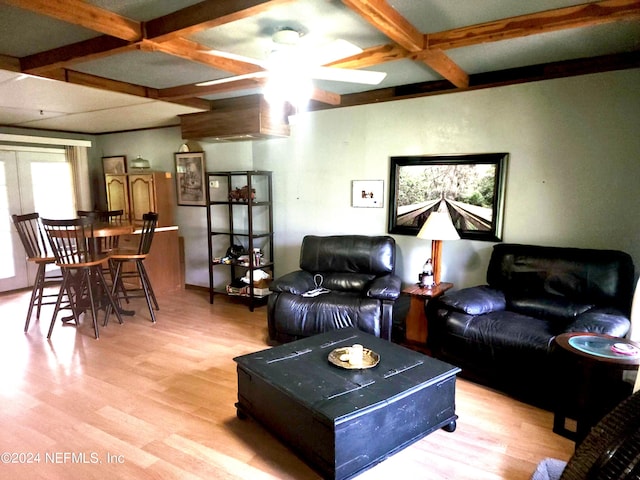 living room featuring coffered ceiling, light wood-type flooring, beam ceiling, ceiling fan, and french doors