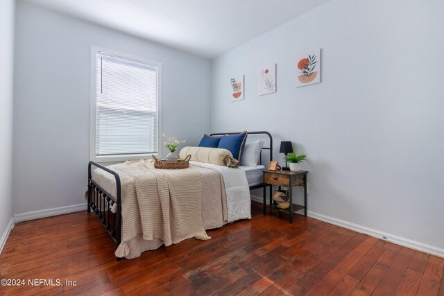 bedroom with wood-type flooring