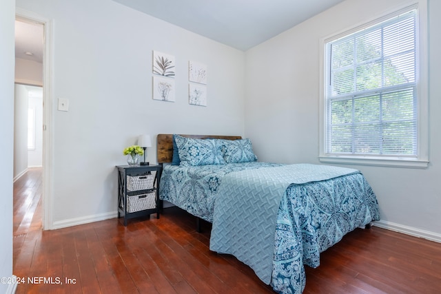 bedroom with hardwood / wood-style flooring