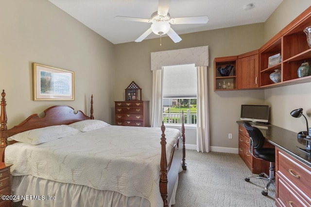 bedroom featuring ceiling fan, baseboards, and light carpet