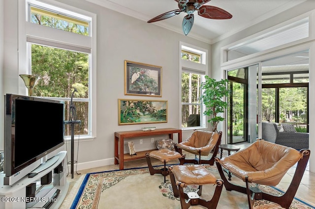 sunroom featuring a ceiling fan