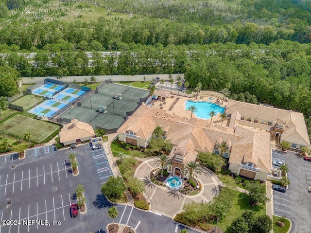 drone / aerial view featuring a view of trees