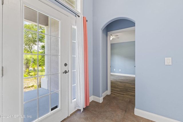 entryway with ceiling fan and dark hardwood / wood-style flooring