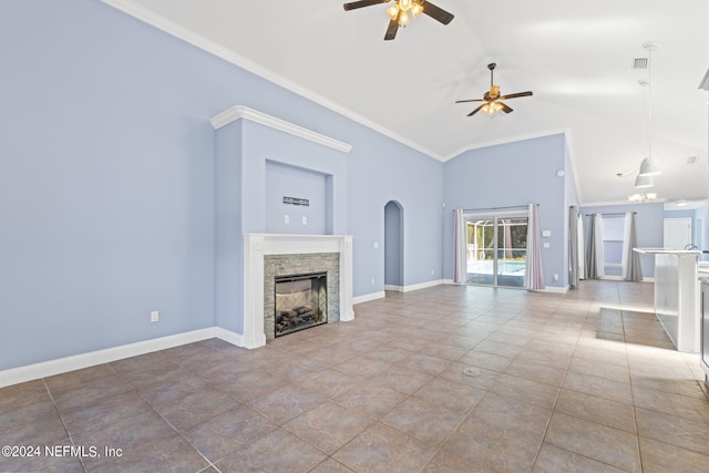 unfurnished living room with crown molding, ceiling fan, a stone fireplace, high vaulted ceiling, and baseboards