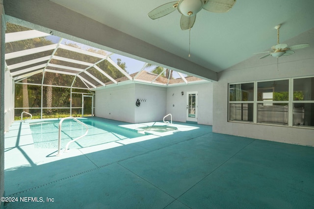 view of swimming pool featuring glass enclosure, ceiling fan, and a patio