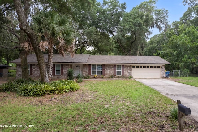 ranch-style home featuring a garage and a front lawn