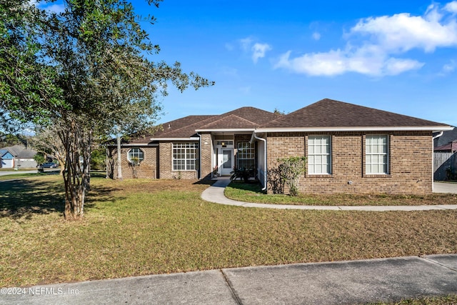 ranch-style house with a front yard