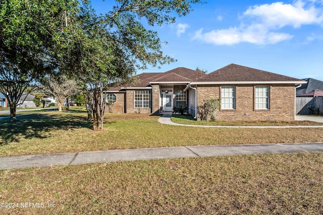 single story home featuring a front yard