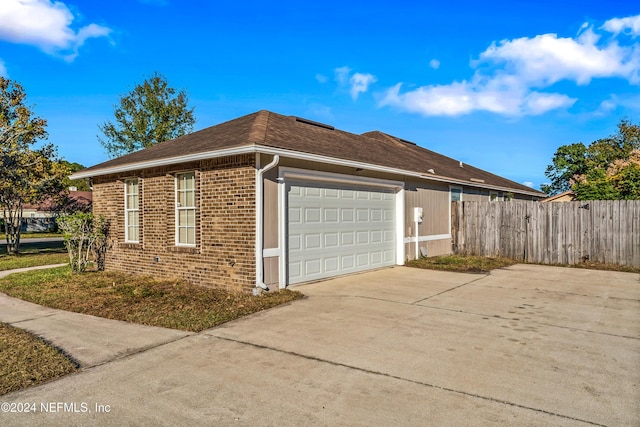 view of side of home with a garage