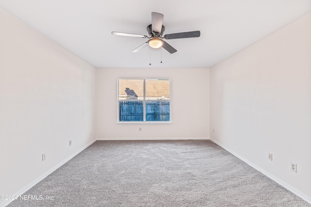 unfurnished room featuring carpet and ceiling fan