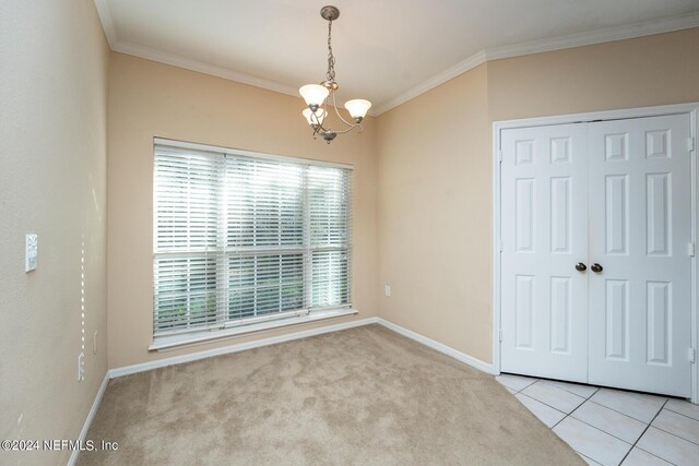 unfurnished bedroom with light carpet, a closet, an inviting chandelier, and ornamental molding