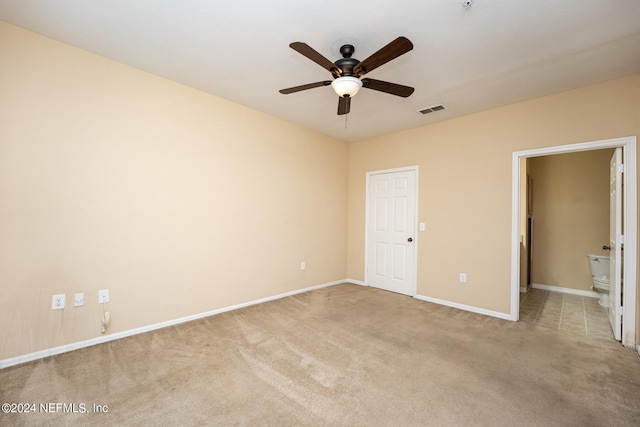 unfurnished bedroom featuring ceiling fan and light carpet