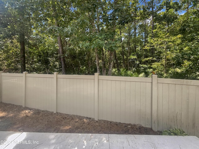 view of gate featuring fence