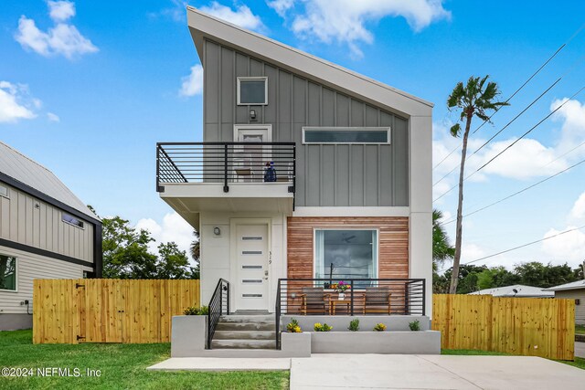 contemporary house featuring a balcony