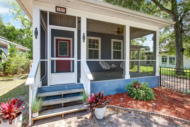 entrance to property with ceiling fan