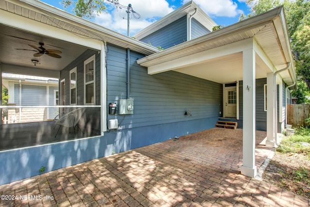 exterior space with ceiling fan