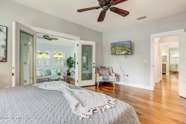 bedroom with ceiling fan and light hardwood / wood-style floors