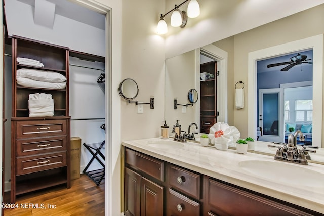 bathroom featuring ceiling fan, vanity, and hardwood / wood-style floors