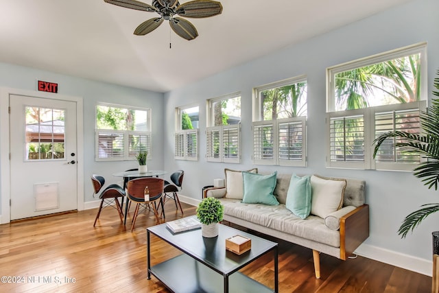 sunroom featuring a healthy amount of sunlight and ceiling fan