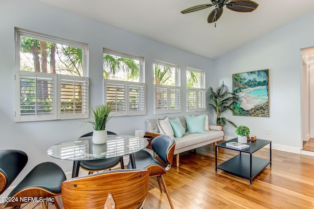 sunroom featuring vaulted ceiling and a ceiling fan