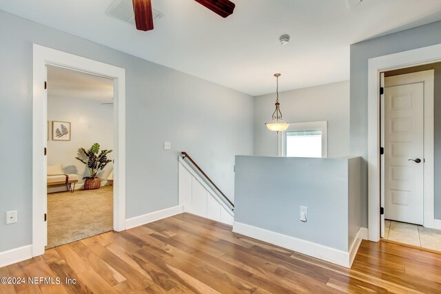 spare room featuring carpet floors and ceiling fan