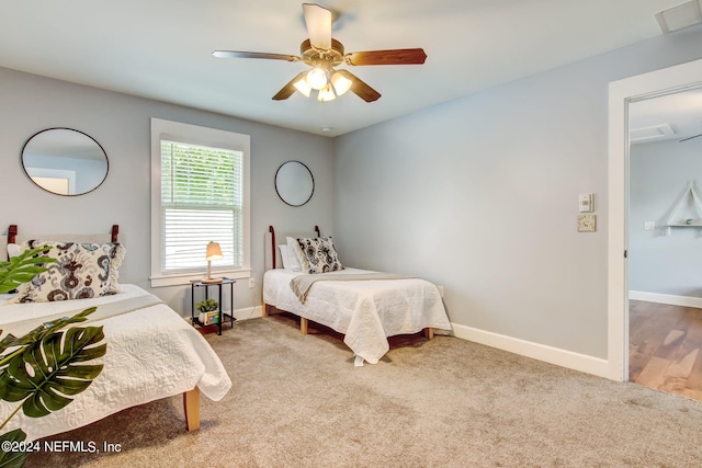 bedroom with light wood-type flooring and ceiling fan