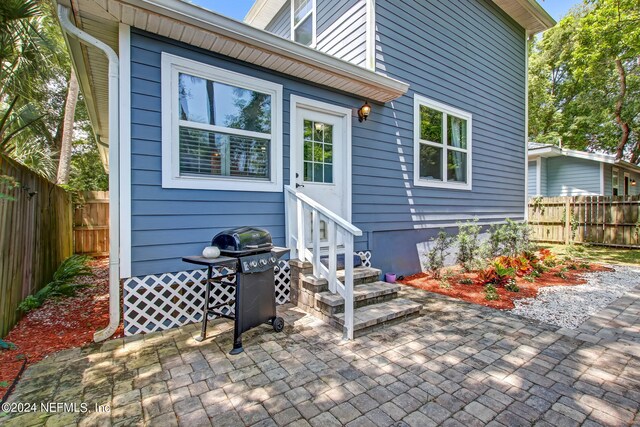 back of house with a patio