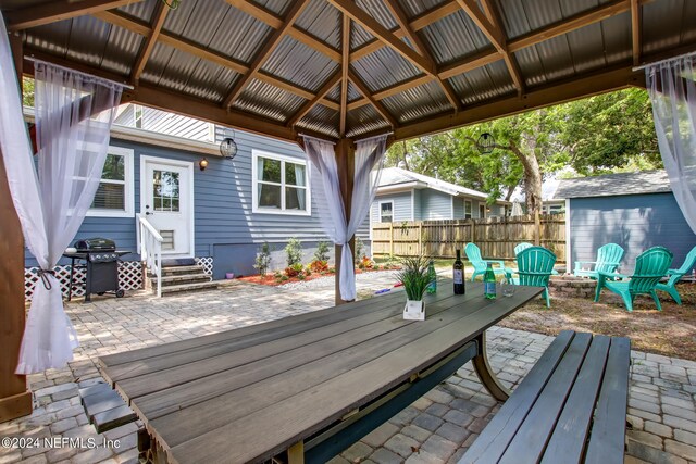 deck with a patio area, a gazebo, and area for grilling